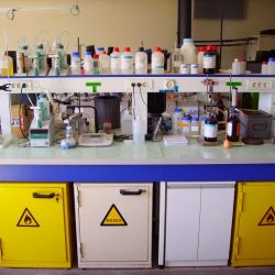 On a lab bench there are four balloons